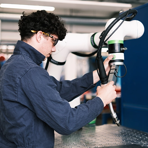 A student using engineering equipment