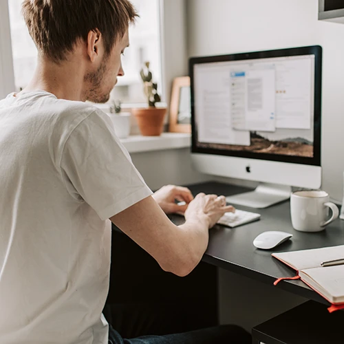 Man at computer in home office
