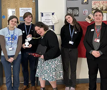 Group of students with teacher and external speaker