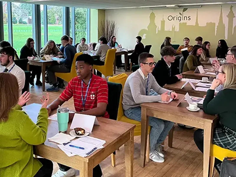 students and employers at tables chatting