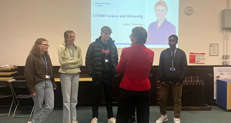 students talking to Helen Sharman in classroom