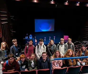 Group of students standing together smiling