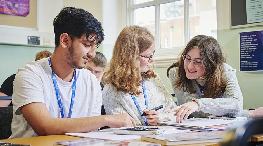 Students reading books and writing