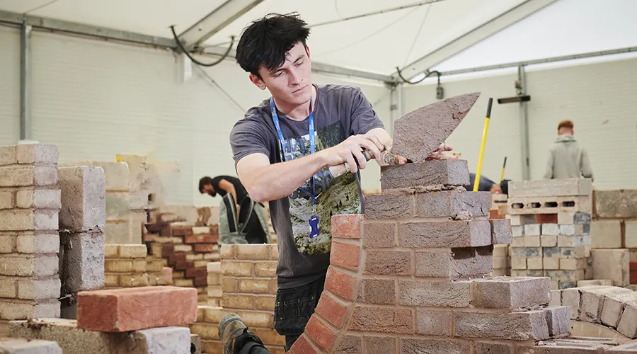 Student building archway in wall