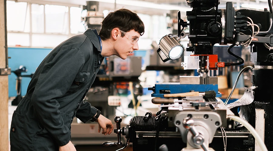 Student using milling machine